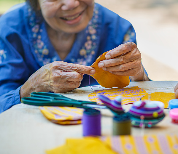 A photo of elderly seamstress